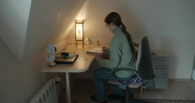 Girl Draw Pictures With Pencil on Desk Table in Bedroom at Home. 4K 10-bit