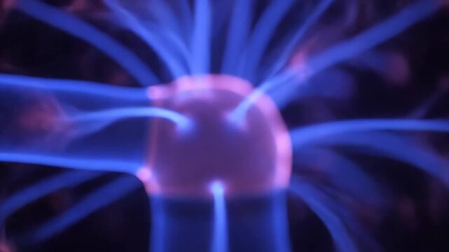 Electricity arcs from Tesla coil in dark laboratory setting