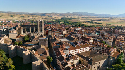 Obraz premium Panoramic aerial view of Avila city walls rooftops and Sierra Gredos mountains