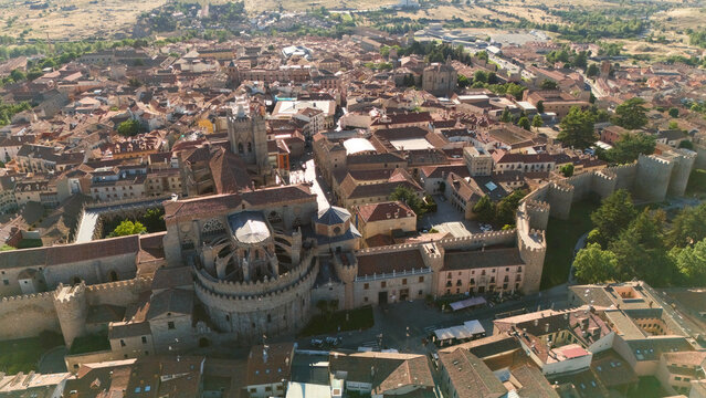 Gothic cathedral of Avila with apse dome towers and adjacent city walls from above