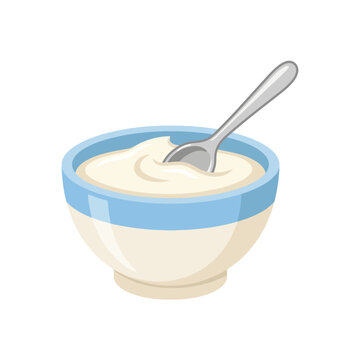 A bowl of fresh creamy yogurt with a silver spoon