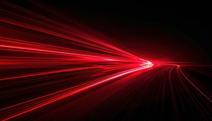 Fototapeta premium Red light trails on a dark background, suggesting speed and movement.