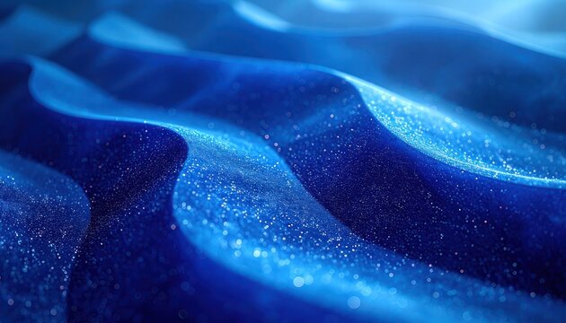 A mesmerizing abstract background features flowing waves of deep blue, illuminated by countless sparkling particles, creating a sense of depth and ethereal beauty.