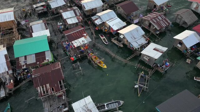 Traditional Bajau Laut Village, Sea Gypsy people in Semporna, Borneo, Malaysia. Stilt Houses Above Sea Waters