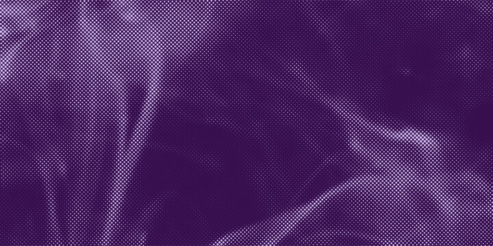 Close-up of textured fabric with purple tie dye patterns.