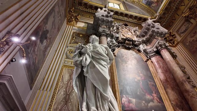 View of virtues and angel statues decorating Cappella San Gaetano Thiene in Rome Italy