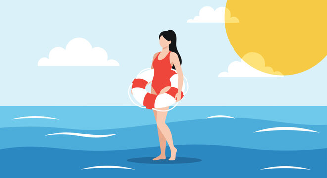 Young female lifeguard in red swimsuit standing in the sea water and holding a red lifebuoy on a sunny summer day.