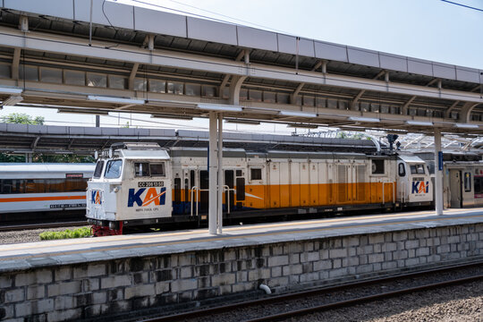 Jakarta, Indonesia - May 28, 2026: A KAI long-distance passenger train led by a CC206 diesel-electric locomotive passing through Jatinegara Station.