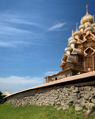 Wooden domes of Transfiguration Church against a blue sky, Kizhi Pogost, Karelia, Russia, June 2019 © Sergei