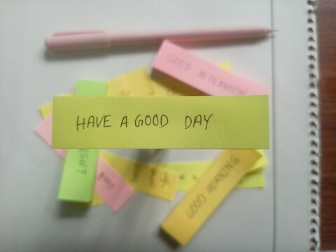 Handwritten Have a Good Day Text on Yellow Sticky Note