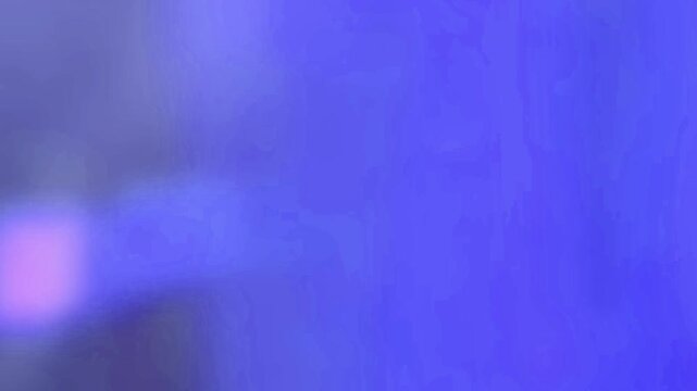 light leak transition from black to purple and blue hues, then back to black. This effect is ideal for scene changes or intros.