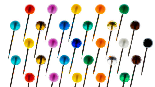 Isolated vibrant set of colorful pushpins with glossy heads and sharp metal pins