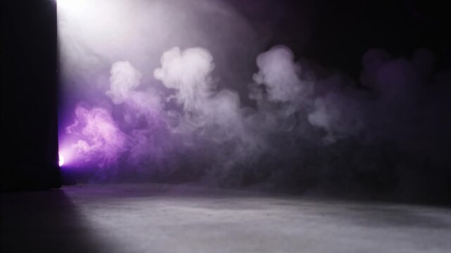 Pulsing purple light starting left-panel emitter, releasing fog across floor under white spotlight