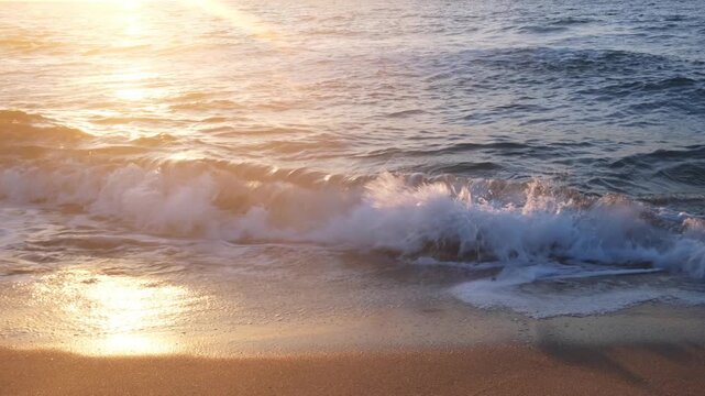 front view footage of waves on shore at sunset crushing toward viewer, moody atmosphere, romantic scenery, suitable for emotional video, meditation, nature., clean environment, yoga