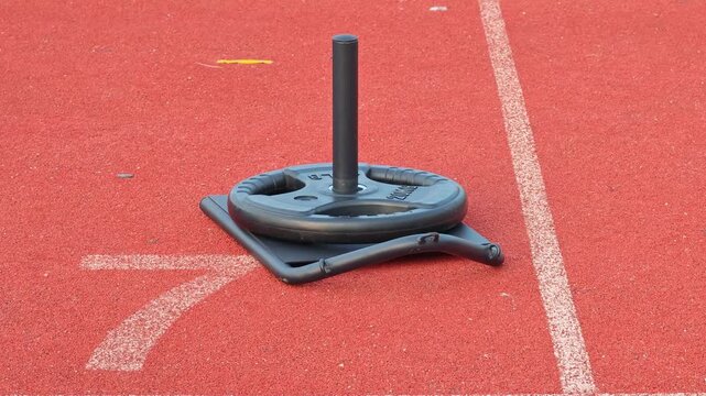 discus throwing sport   , sports field.