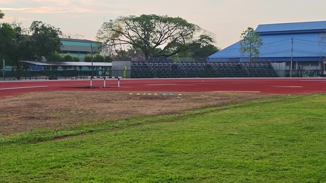 discus throwing sport  , sports field.