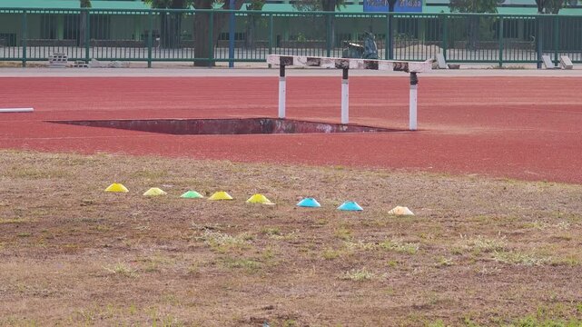 discus throwing sport  , sports field.