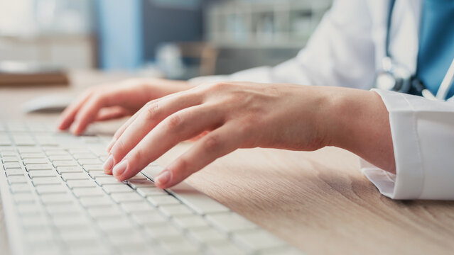 Healthcare professional working on computer