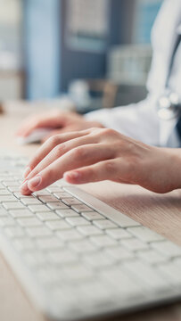 Healthcare professional working on computer