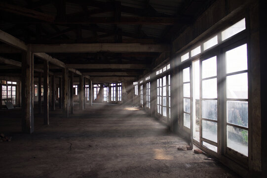 Sunbeams streaming through an abandoned building