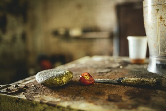 Knife, stone and chilli pepper in a kitchen in a dwelling in Petare, Venezuela