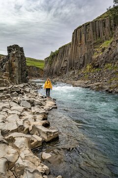 Tourist at Stu&eth;lagil Canyon, basalt columns, Egilsstadir, Iceland