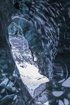 Ice cave open to the top with snow-covered ice combs, Pr&ouml;ng ice cave, Sudurland, Iceland