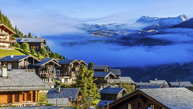 Roofs covered with hoarfrost, fog rising, Grimentz, Val d'Anniviers, Valais Alps, Canton Valais, Switzerland