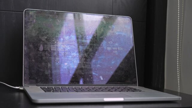 High-quality sound recording in uncompressed WAV format of an old laptop under heavy load, with a loud cooling fan and steady computer hum from the worn device for Foley, editing, and audio library