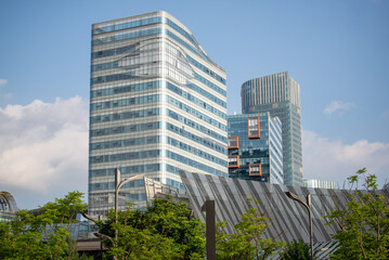 Fototapeta premium Modern Office Skyscrapers Under Clear Blue Sky