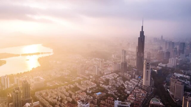 Aerial timelapse of the sunrise glow over the skyline of Xuanwu Lake in Nanjing, Jiangsu Province, China