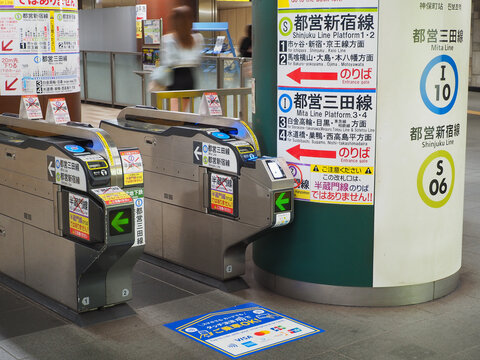 TOKYO, JAPAN - June 19, 2026: Tickets gates at Jimbocho TOEI subway station for Mita Line and Shinjuku Line platforms.