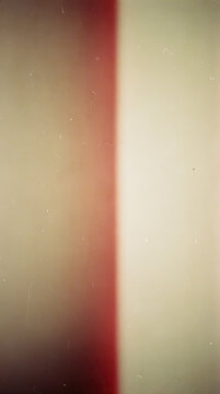 Vintage film light leak overlay with authentic dust and grain texture.