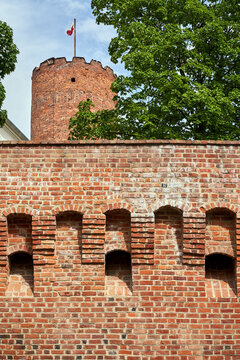 Medieval defensive wall and tower of the historic Knights of St. John castle in Lagow