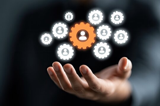 Abstract digital human figures in gears floating over open hand