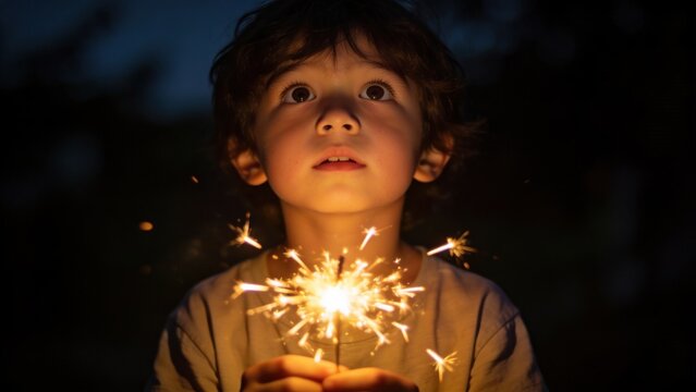 Child holding sparkler at night, wonder and magic, bokeh background