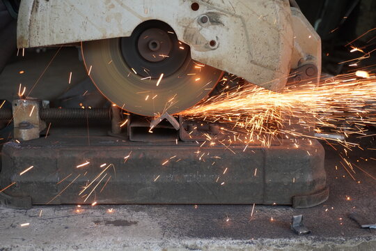 Circular Saw Cutting Metal with Sparks