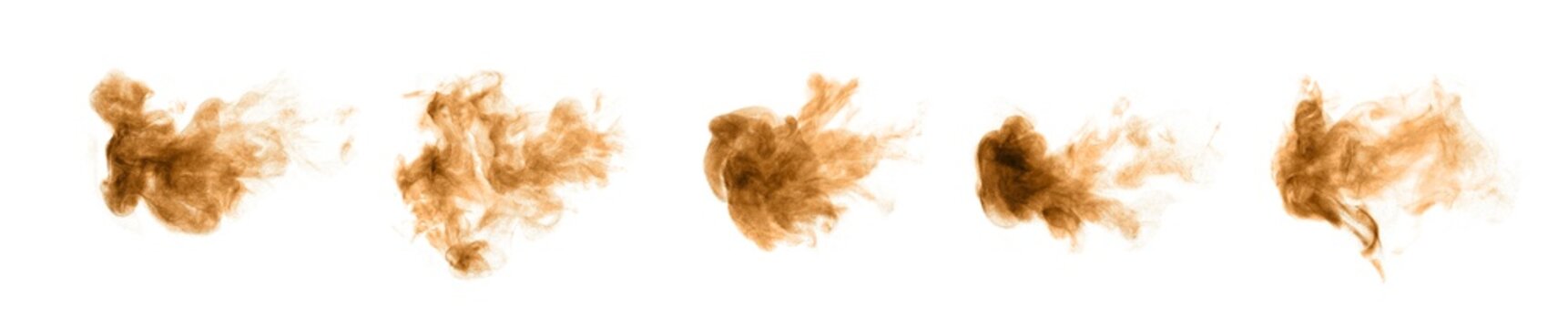 Golden and brown sand dust like smoke swirling in a bomb storm, spraying in the air as colorful lumps on a black and white background.