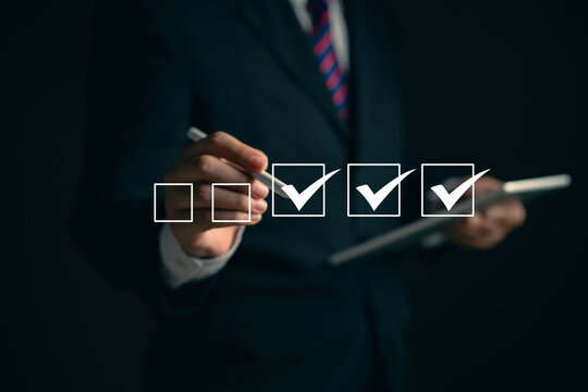 oung business woman using laptop surveys online checklist Complete the digital form checklist via the internet..Business performance checklist concept Y
