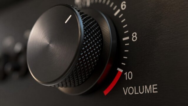 Extreme close-up of a volume knob being turned from low to the maximum red zone.