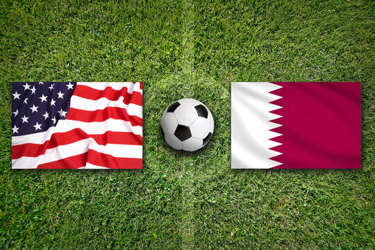 USA vs. Katar flags on a soccer field