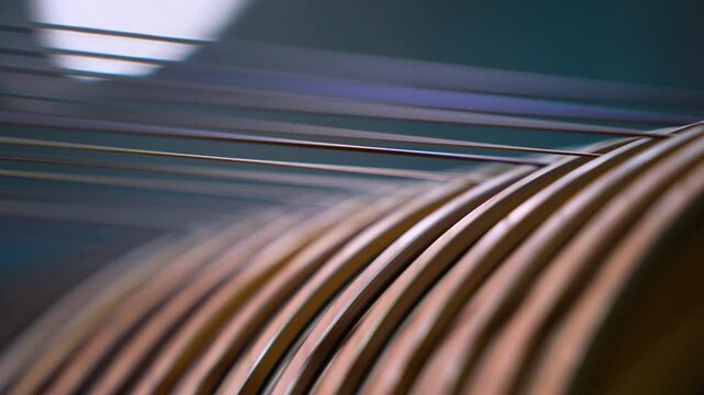 copper wire making process. wire drawing at factory. bronze coating thin wire running in machine close up. copper spools, winding spool of wire. copper, Galvanized Steel Wire. High carbon steel wire