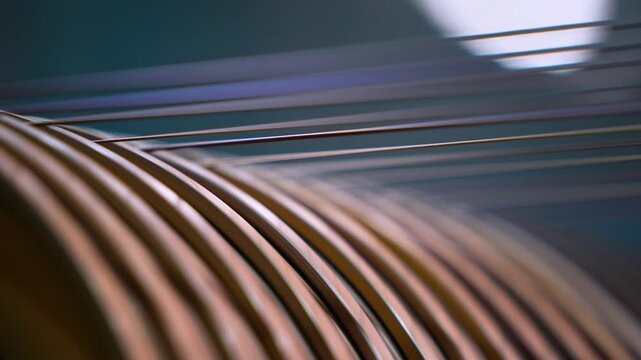 copper wire making process. wire drawing at factory. bronze coating thin wire running in machine close up. copper spools, winding spool of wire. copper, Galvanized Steel Wire. High carbon steel wire