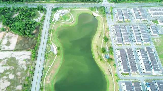 Gigantic lake shaped like a peanut near a residential area in Malaysia.
