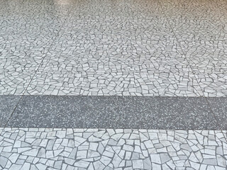 Textured surface with abstract design in urban setting showing natural materials and space for text