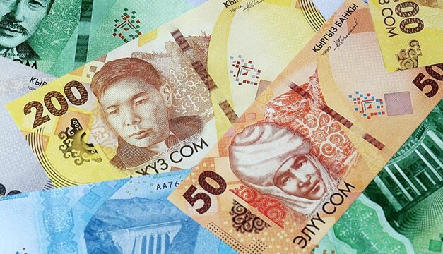Kyrgyzstani som money bills in pile. Big amount of Kyrgyzstan KGS currency cash close up