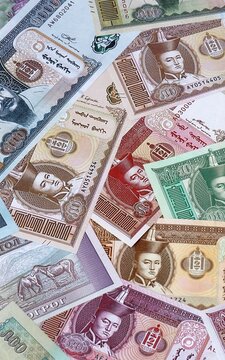 Mongolian tugrik money bills in pile. Big amount of Mongolia MNT currency cash close up