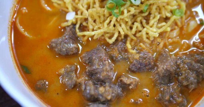 Close up of northern Thai beef khao soi noodle curry soup