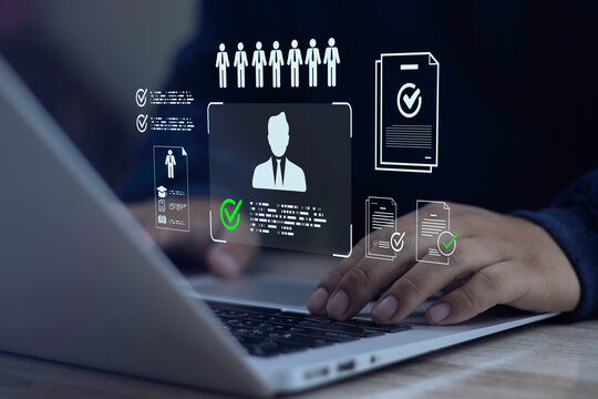 HR manager typing on laptop analyzing recruitment analytics dashboard on virtual screen. Concept of data-driven hiring, talent acquisition optimization, and candidate screening.