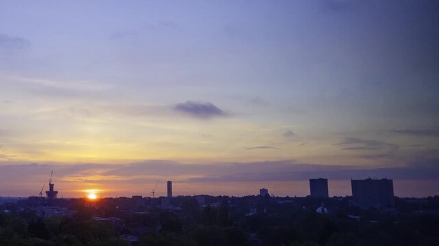 Birmingham City Skyline Eastside Sunrise Timelapse 
Time-lapse video capturing a dramatic golden sunrise breaking over the Eastside district skyline of Birmingham, United Kingdom.